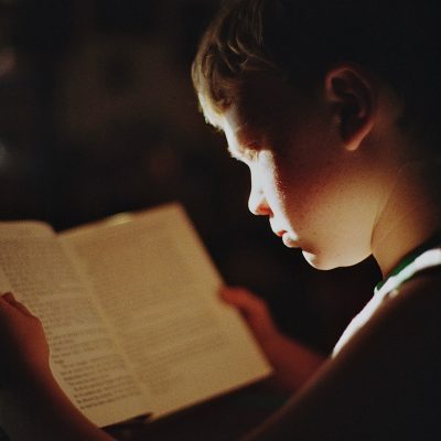 Boy focusing on reading